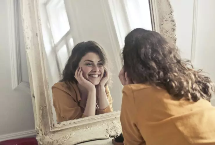 Photo of Woman Looking at the Mirror